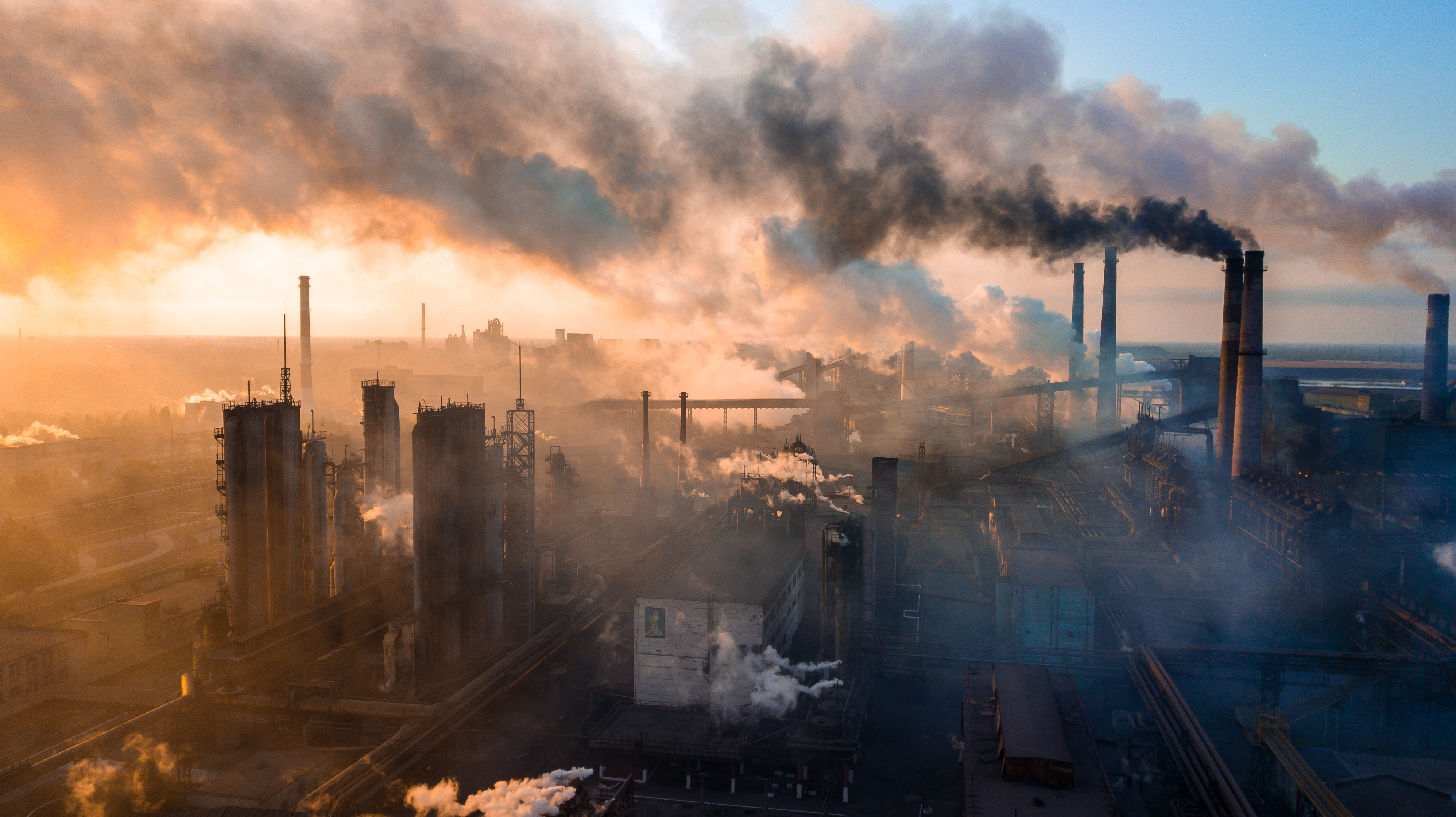 industry metallurgical plant dawn smoke smog emissions bad ecology aerial photography